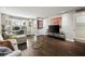 Bright living room featuring hardwood floors, modern furniture, and an adjacent office nook at 3063 Chastain Park Ne Ct, Atlanta, GA 30342