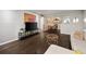 Open-concept living area with a view to the dining space and media center at 3063 Chastain Park Ne Ct, Atlanta, GA 30342