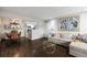Inviting living area with an adjacent dining space, sofa, and hardwood floors at 3063 Chastain Park Ne Ct, Atlanta, GA 30342
