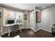 Well-lit office nook featuring a modern desk, chair, and view of the outdoor area at 3063 Chastain Park Ne Ct, Atlanta, GA 30342