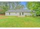 Large backyard with a patio area with direct entry to the single story house at 4547 Atha Cir, Loganville, GA 30052