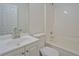 Bright bathroom featuring a white vanity, mirror, toilet, and shower-tub combination at 4547 Atha Cir, Loganville, GA 30052