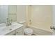 Bathroom featuring a vanity with a sink, mirror, toilet, and shower over tub at 4547 Atha Cir, Loganville, GA 30052