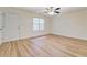 Well-lit bedroom features stylish wood-look floors and a ceiling fan at 4547 Atha Cir, Loganville, GA 30052