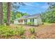 Charming single-story home with a gray exterior, front porch and landscaped yard at 4547 Atha Cir, Loganville, GA 30052