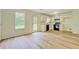 Eat-in kitchen features modern floors, white cabinets, and a view to the back yard at 4547 Atha Cir, Loganville, GA 30052