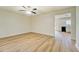 Bright living room featuring wood-look floors and a ceiling fan at 4547 Atha Cir, Loganville, GA 30052