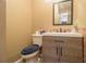 A cozy bathroom features a modern vanity, toilet, and mirror, offering essential amenities in a compact space at 556 Country Greens Dr, Jonesboro, GA 30238