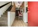 Entryway featuring stairs, brick accent wall, and hardwood-style floors at 556 Country Greens Dr, Jonesboro, GA 30238