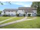 Spacious front lawn and walkways leading to this cozy townhome at 556 Country Greens Dr, Jonesboro, GA 30238