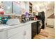 Functional kitchen showcasing ample counter space, essential appliances, and natural light from a window at 556 Country Greens Dr, Jonesboro, GA 30238