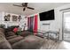Comfortable living room with an oversized sofa and entertainment area at 556 Country Greens Dr, Jonesboro, GA 30238