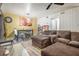 Comfortable living room flows into the dining area and features an oversized sofa at 556 Country Greens Dr, Jonesboro, GA 30238