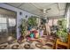 Cozy sunroom filled with plants and an area rug offering a relaxing space with natural light at 556 Country Greens Dr, Jonesboro, GA 30238
