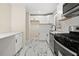 Modern kitchen with white cabinets, subway tile backsplash, and stainless steel appliances at 817 N Evelyn Nw, Atlanta, GA 30318