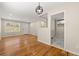 Bright living room with hardwood floors, white walls, and a modern light fixture at 817 N Evelyn Nw, Atlanta, GA 30318