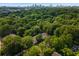 Panoramic aerial view showcasing lush trees and the city skyline, blending nature and urban living at 1150 Collier Nw Rd # L14, Atlanta, GA 30318
