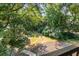 Spacious backyard with lush green trees, offering a private and serene outdoor space at 1150 Collier Nw Rd # L14, Atlanta, GA 30318