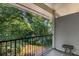Relaxing balcony view overlooking lush green trees, inviting nature into your home at 1150 Collier Nw Rd # L14, Atlanta, GA 30318