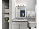 Well-lit bathroom featuring granite vanity, ample storage, and a shower-tub combination at 1150 Collier Nw Rd # L14, Atlanta, GA 30318