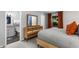Bedroom featuring stylish decor, a queen bed, a dresser, and an ensuite bathroom at 1150 Collier Nw Rd # L14, Atlanta, GA 30318