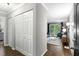 Inviting entryway leading to a well-lit living room with hardwood floors and ample closet space at 1150 Collier Nw Rd # L14, Atlanta, GA 30318