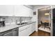 This eat-in kitchen is equipped with stainless steel appliances and granite countertops at 1150 Collier Nw Rd # L14, Atlanta, GA 30318