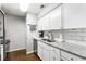 Bright kitchen features granite countertops, stainless steel appliances, and white subway tile backsplash at 1150 Collier Nw Rd # L14, Atlanta, GA 30318