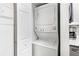 Efficient laundry area equipped with stacked washer and dryer at 1150 Collier Nw Rd # L14, Atlanta, GA 30318
