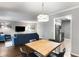Spacious living room with stylish furniture, a dining area, and an open view into the kitchen at 1150 Collier Nw Rd # L14, Atlanta, GA 30318
