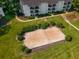 Aerial view of community sand volleyball court surrounded by lush landscaping and apartment buildings at 1150 Collier Nw Rd # L14, Atlanta, GA 30318