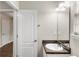 Bathroom with vanity, sink and tiled floors at 165 Heaton Place Trl, Covington, GA 30016