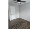 Bedroom featuring wood-look tiled floors and a ceiling fan at 165 Heaton Place Trl, Covington, GA 30016