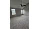 Spacious bedroom featuring neutral walls, vaulted ceilings, and a ceiling fan at 165 Heaton Place Trl, Covington, GA 30016