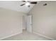 Neutral bedroom featuring plush carpet, vaulted ceiling, and a ceiling fan at 165 Heaton Place Trl, Covington, GA 30016