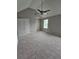 Bedroom with fresh paint, carpet, ceiling fan, and a vaulted ceiling at 165 Heaton Place Trl, Covington, GA 30016