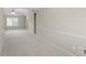 Spacious carpeted bedroom featuring vaulted ceiling, a ceiling fan, and light-filled window at 165 Heaton Place Trl, Covington, GA 30016