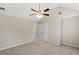 Bedroom featuring plush carpet, vaulted ceiling, ceiling fan, and an en-suite bathroom at 165 Heaton Place Trl, Covington, GA 30016