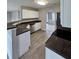 Well-equipped kitchen with stainless steel appliances and granite countertops at 165 Heaton Place Trl, Covington, GA 30016