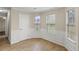 Living room with wood floors and views of the outdoor landscape at 165 Heaton Place Trl, Covington, GA 30016