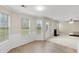 Spacious living room with lots of natural light and fireplace at 165 Heaton Place Trl, Covington, GA 30016