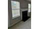 Living room featuring a decorative fireplace and bright windows at 165 Heaton Place Trl, Covington, GA 30016