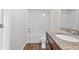 Bathroom showcasing granite vanity and bathtub with shower at 1931 Old Dogwood, Jonesboro, GA 30238