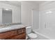 Bathroom featuring a granite-topped vanity and a shower-tub combo at 1931 Old Dogwood, Jonesboro, GA 30238
