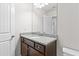 Bathroom with a wood vanity with granite countertop and ample storage at 1931 Old Dogwood, Jonesboro, GA 30238