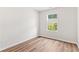 Bright bedroom with wood floors, a large window, and neutral paint at 1931 Old Dogwood, Jonesboro, GA 30238