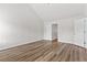 Bedroom with hardwood-style flooring, vaulted ceiling, and two entry doors at 1931 Old Dogwood, Jonesboro, GA 30238