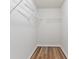 Walk-in closet featuring shelving and hardwood-style flooring at 1931 Old Dogwood, Jonesboro, GA 30238