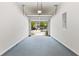 Spacious garage with epoxy flooring and view of the driveway and neighborhood at 1931 Old Dogwood, Jonesboro, GA 30238