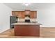 Kitchen with a granite island countertop and view of the dark appliances at 1931 Old Dogwood, Jonesboro, GA 30238